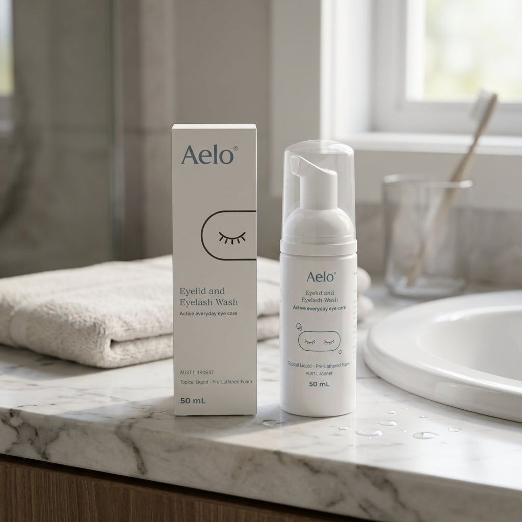 Aelo Eyelid & Eyelash Wash bottle and box on a bathroom vanity