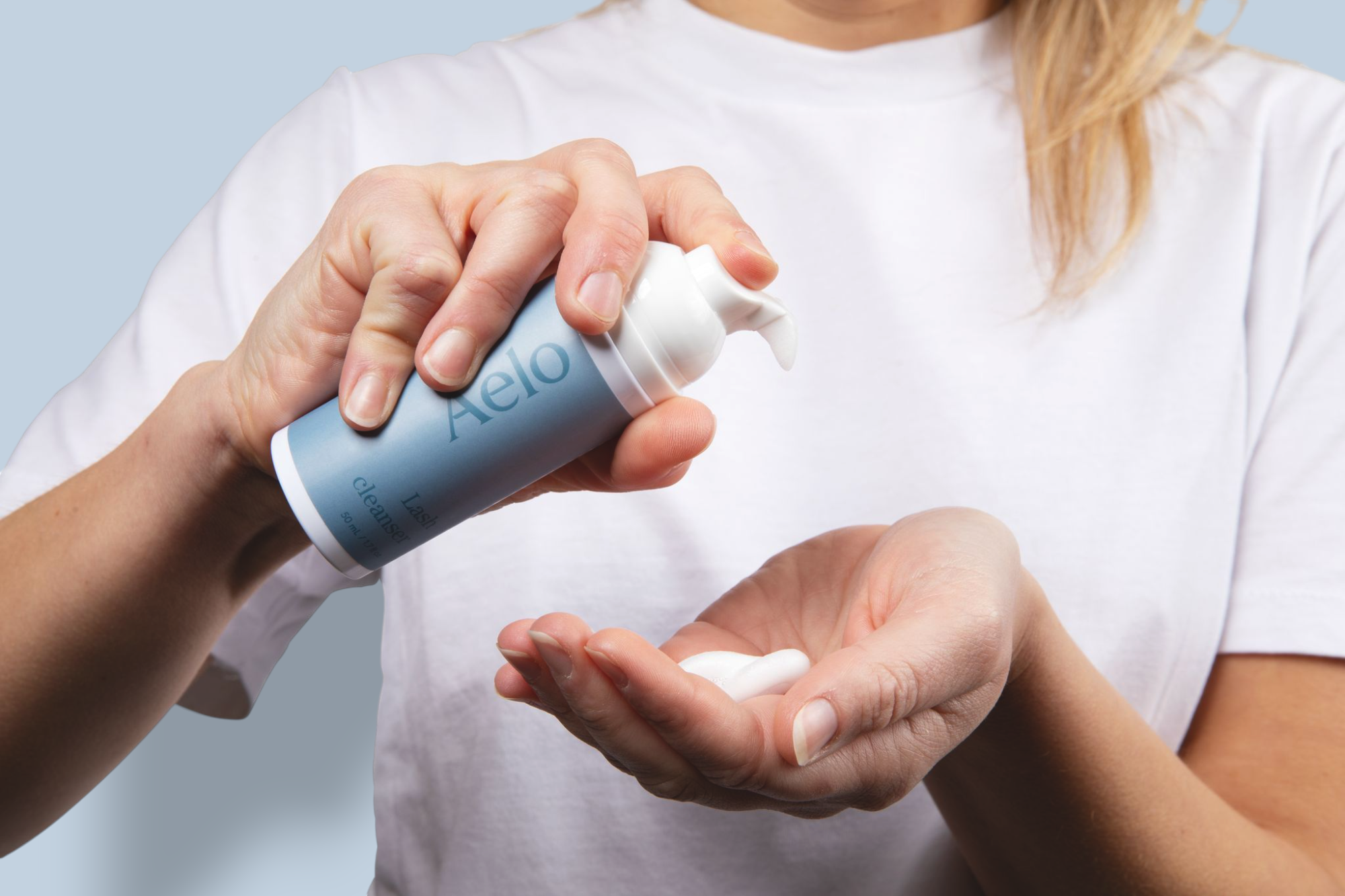 Aelo Eyelid and Eyelash Cleanser Being Pumped on Model Hand
