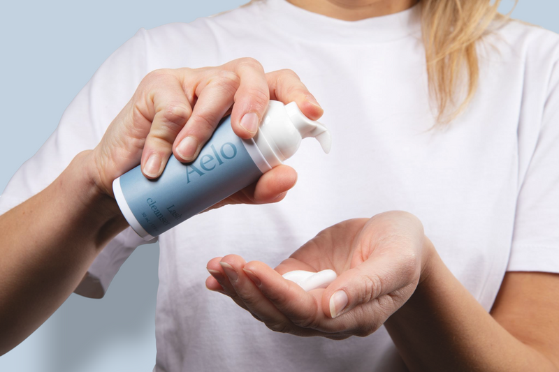 Aelo Eyelid and Eyelash Cleanser Being Pumped on Model Hand